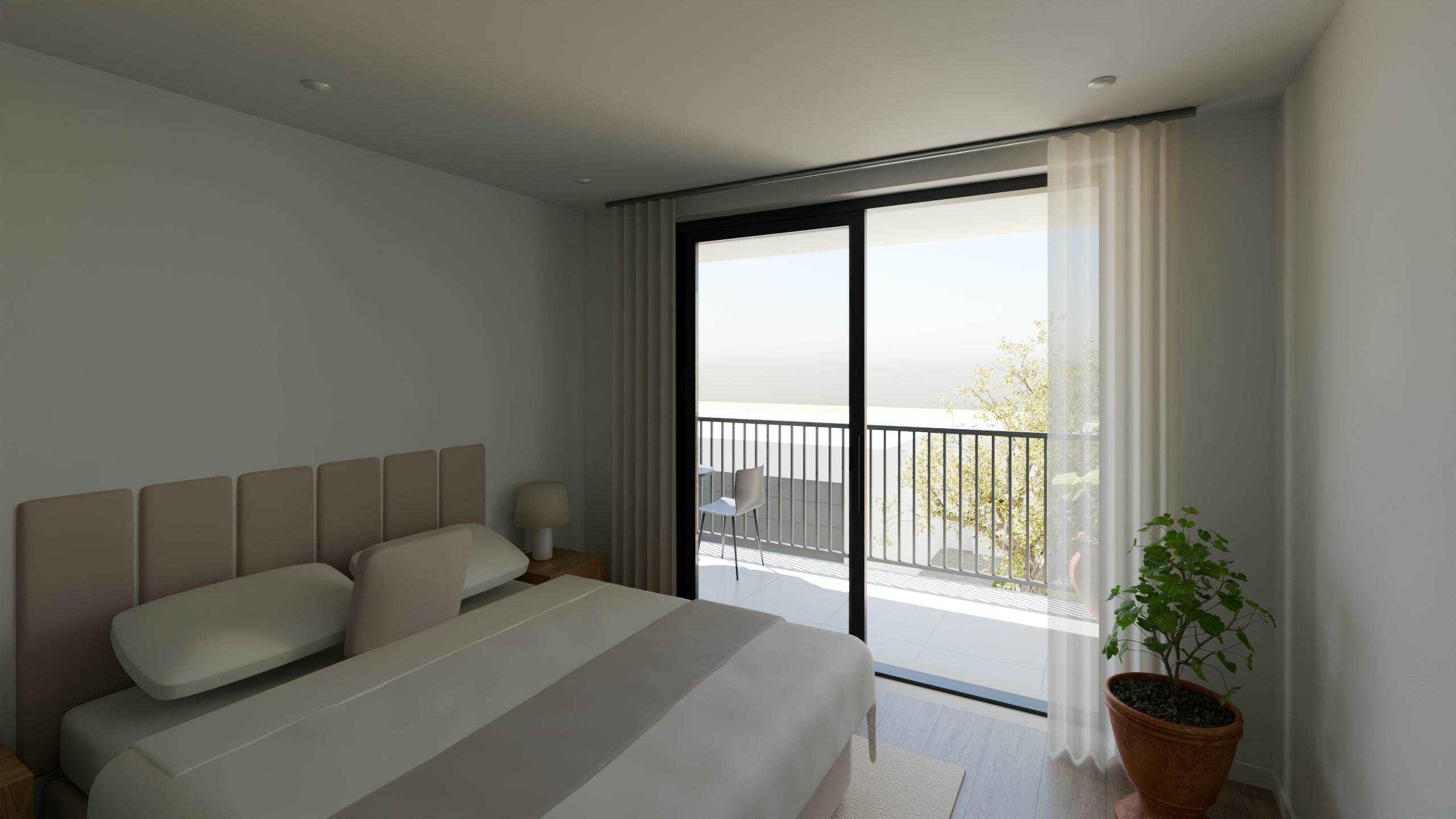 Quarto poente da moradia T3, com janela para a varanda.